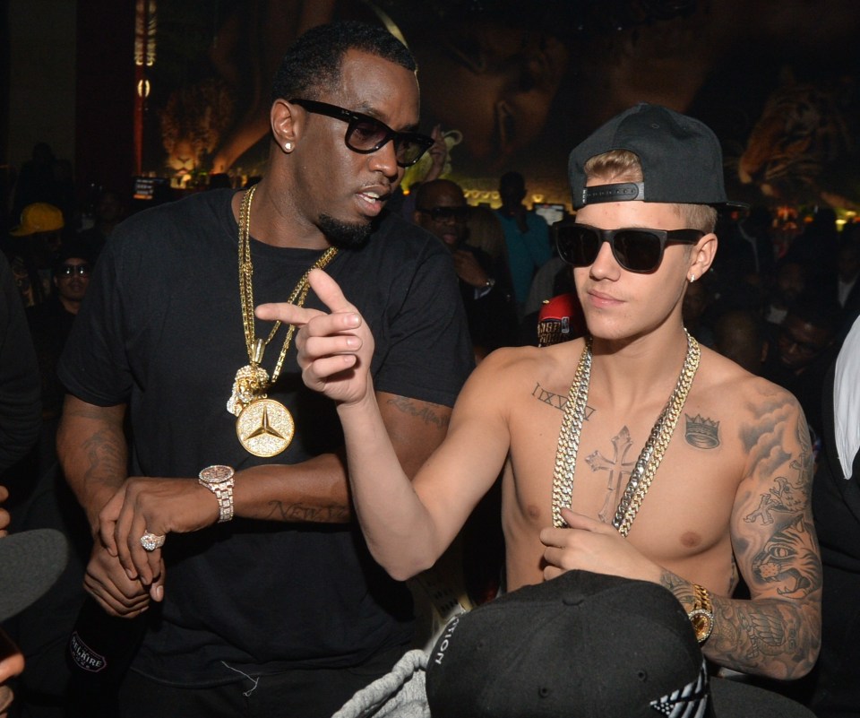 Jermaine Dupri, Alex Gidewon, Sean Combs, and Justin Bieber at a party.