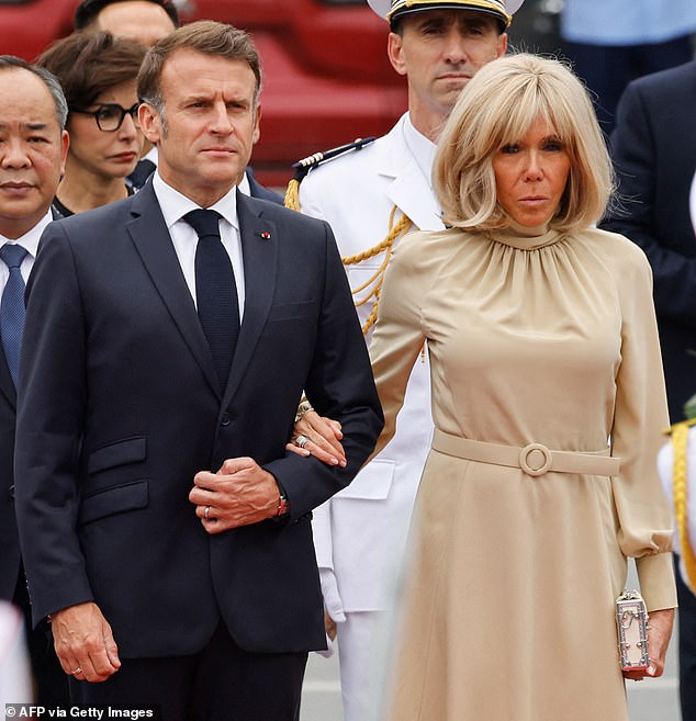 The first impression the geriatric French First Lady made when she and husband, President Emmanuel Macron, landed in Hanoi, Vietnam on Monday was of her palm print and she made it right in his face. (Pictured: Emmanuel and Brigitte Macron in Hanoi on May 26).