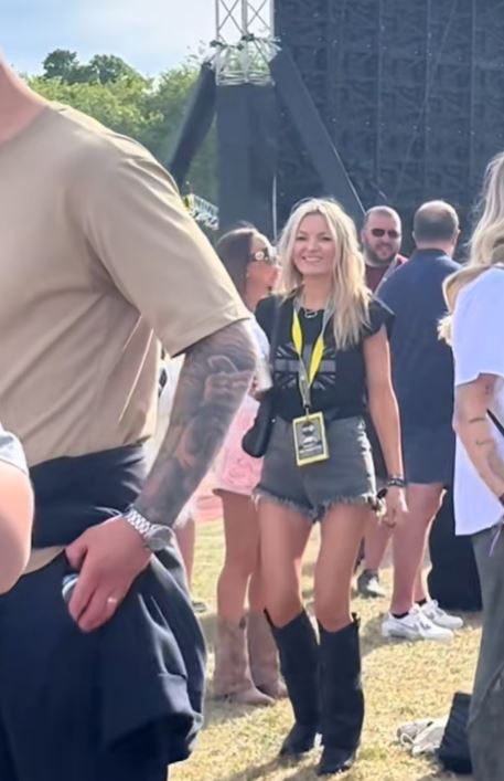 Woman in boots at a music festival.