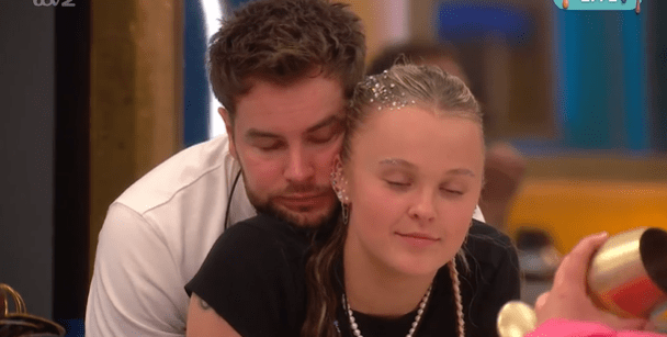 Chris Hughes embracing JoJo Siwa.