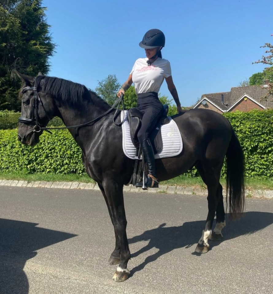 Woman horseback riding.