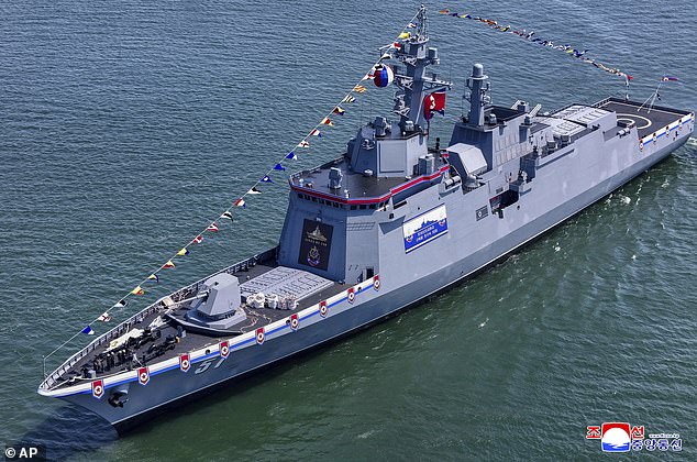 A launch ceremony for a new North Korean naval destroyer went horribly wrong in front of 'supreme' leader Kim Jong Un, according to state media. Pictured: A different naval destroyer unveiled in Nampo, North Korea, last month