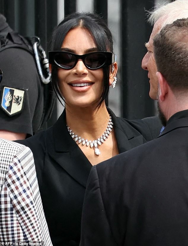 Kim Kardashian sported a lavish diamond necklace and earrings as she prepared to testify at the trial of a gang accused of robbing her at gunpoint in her Paris hotel room in 2016