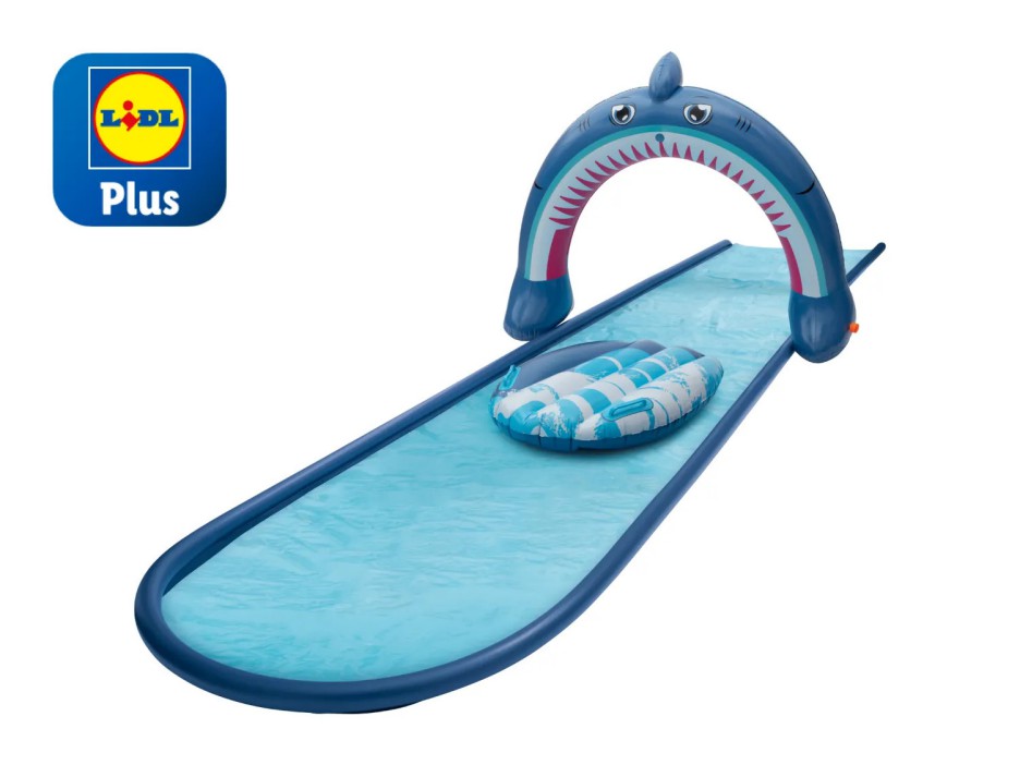 Inflatable shark arch water slide with inner tube.