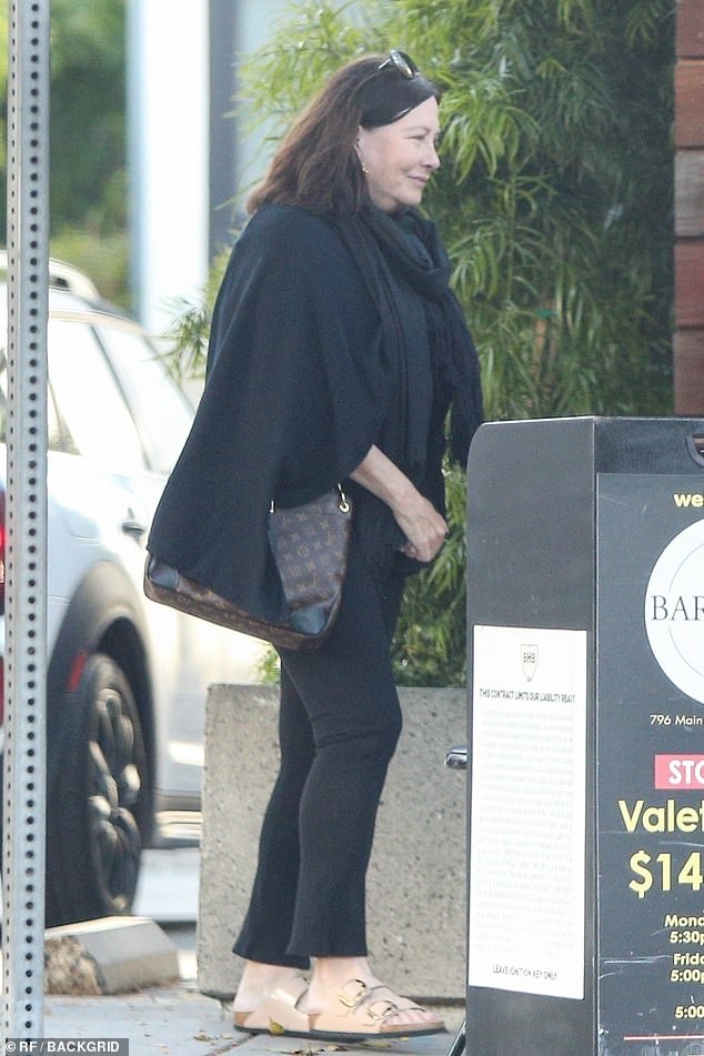 Linda Kozlowski (pictured) looked unrecognisable as she was spotted on a rare outing with her ex-husband Paul Hogan, their son Chance and her longtime partner Moulay Hafid Baba in LA