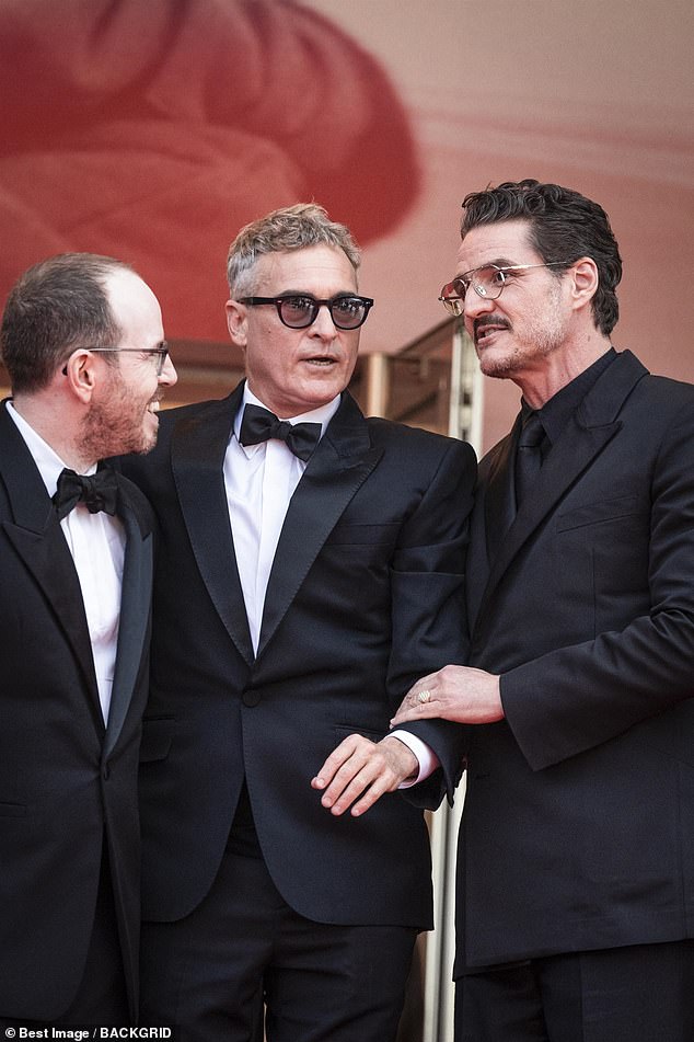 A lip reader has explained what Pedro Pascal told Joaquin Phoenix after he pulled down the actor's waving hand while on the red carpet of the Cannes Film Festival