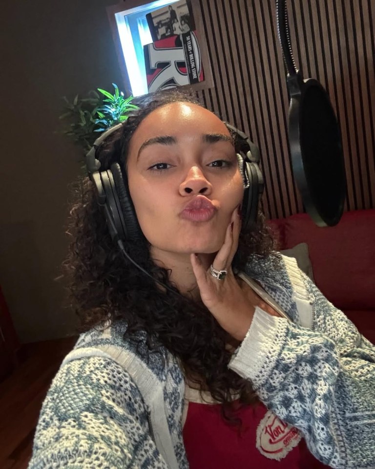 Woman in recording studio making a kissy face.