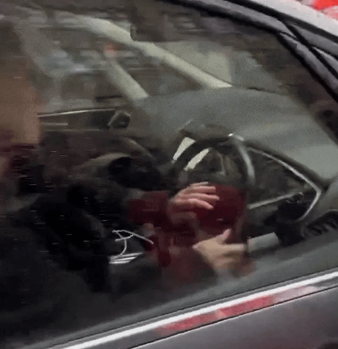 Person driving a car.