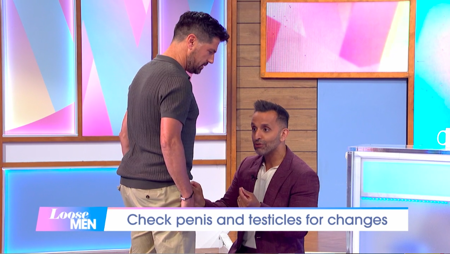 Screenshot of a segment from Loose Men, showing a man demonstrating how to check for changes in the penis and testicles.