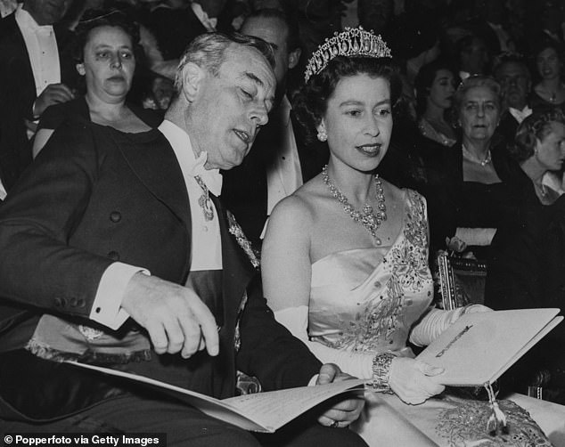 The late Queen pictured speaking with Louis Mountbatten, 1st Earl Mountbatten of Burma, in March 1958