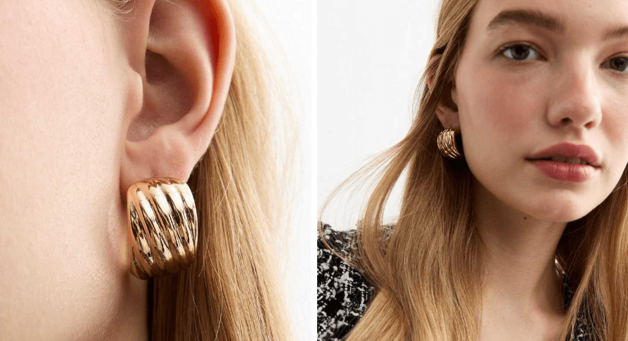 Gold ribbed hoop earrings.