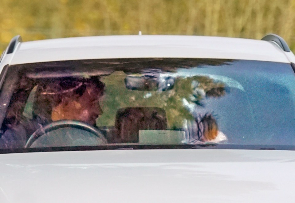 Georges Berthonneau driving a white car.
