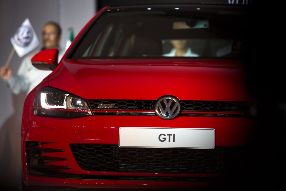 Close-up of a red Volkswagen Golf GTI.