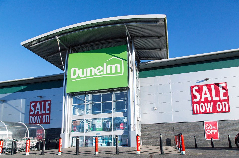 Dunelm store exterior with sale signs.