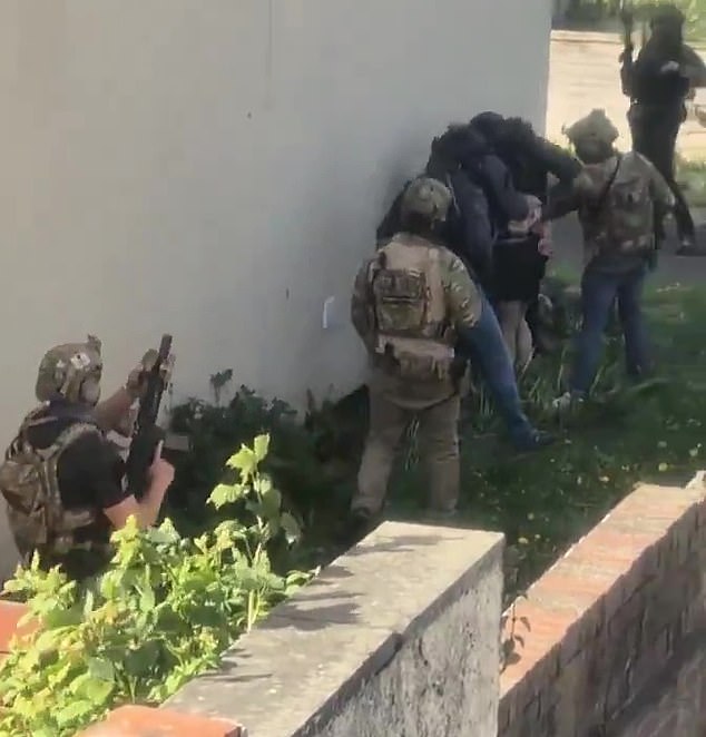 On Sunday, residents described how around 30 armed police supported by Special Forces burst into a terraced property in Rochdale on Saturday at around 7pm. Neighbours captured the moment on camera as a 40-year-old Iranian was dragged outside in just his underpants