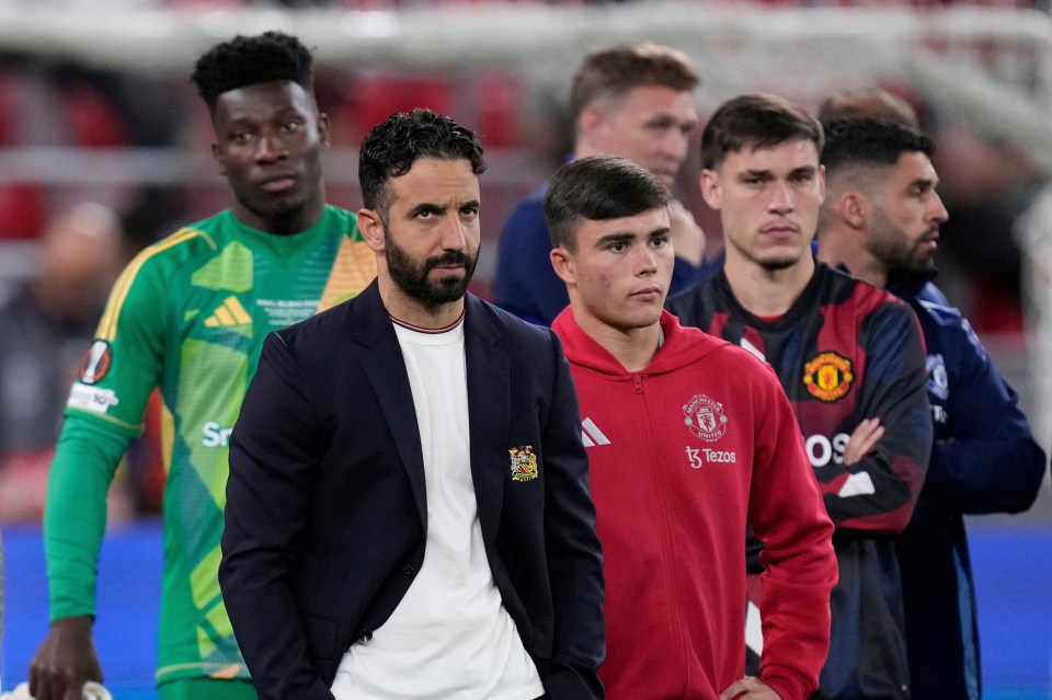 Manchester United's head coach and players after a soccer match.