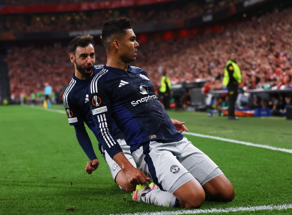 Casemiro of Manchester United celebrates a goal with a teammate.