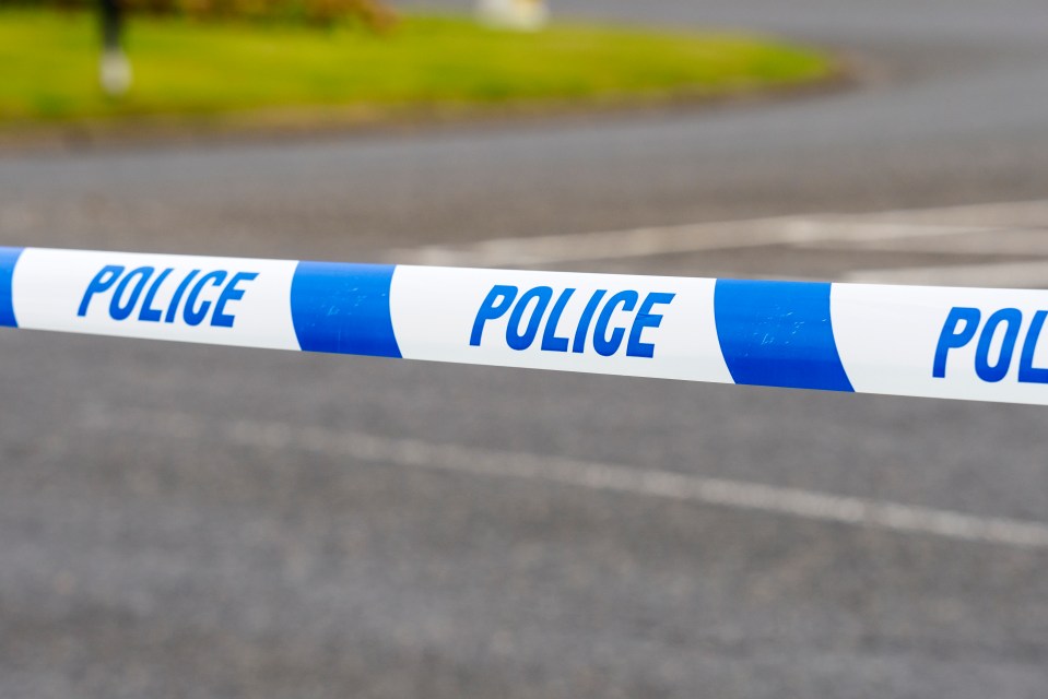 Police tape cordoning off a crime scene.