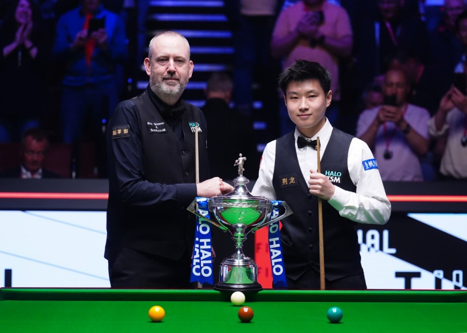 Mark Williams and Zhao Xintong pose with the trophy prior to the Final on day sixteen of the Halo World Snooker Championship at the Crucible Theatre, Sheffield. Picture date: Sunday May 4, 2025. PA Photo. See PA story SNOOKER World. Photo credit should read: Mike Egerton/PA Wire. RESTRICTIONS: Use subject to restrictions. Editorial use only, no commercial use without prior consent from rights holder.