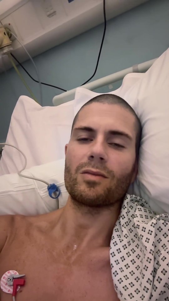 Man lying in a hospital bed.