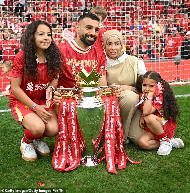 Mo Salah is pictured with his wife Magi Salah and their children Makka (left) and Kayan (right) on Sunday as Liverpool celebrates winning the Premier League