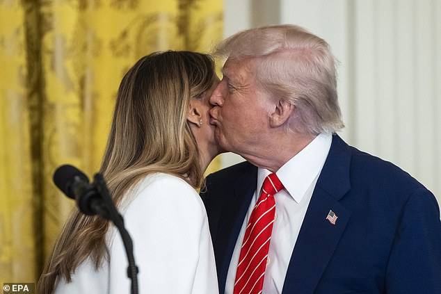 Trump plants a kiss on Melania's cheek during Mother's Day event at the White House