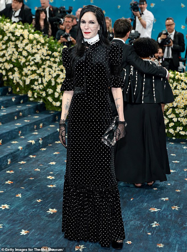 Gone goth? Author Jill Kargman went for a dramatic look on the red carpet, sporting a long, velvet, polka-dotted dress with puff sleeves and a white collar. She accessorized with a pair of short, sheer, polka-dot gloves