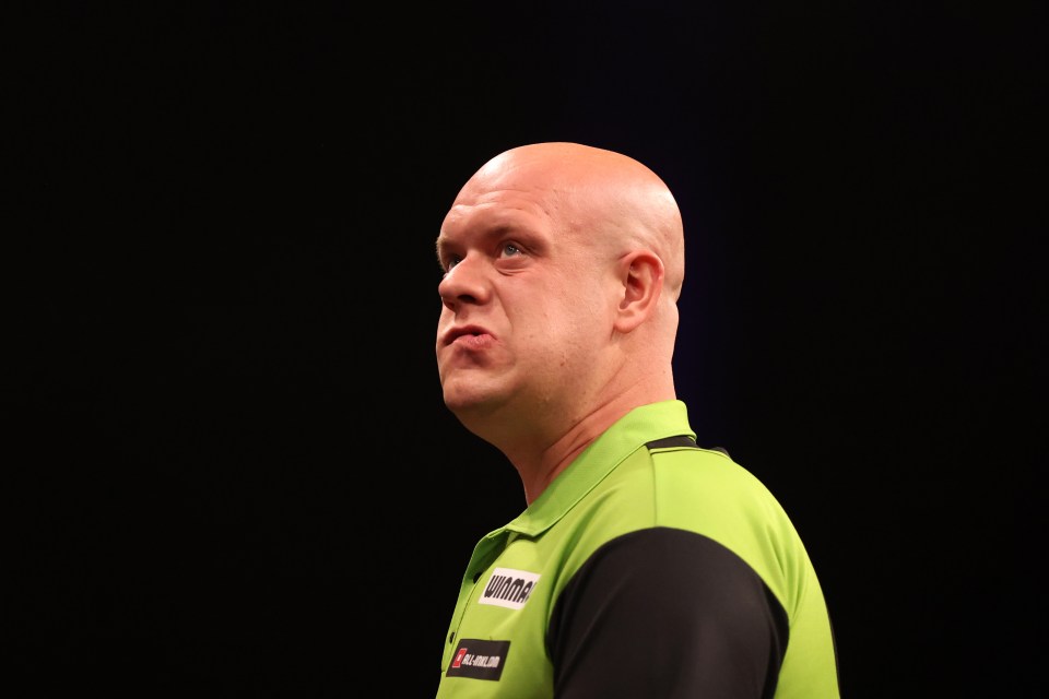 Michael van Gerwen of the Netherlands reacting during a darts match.
