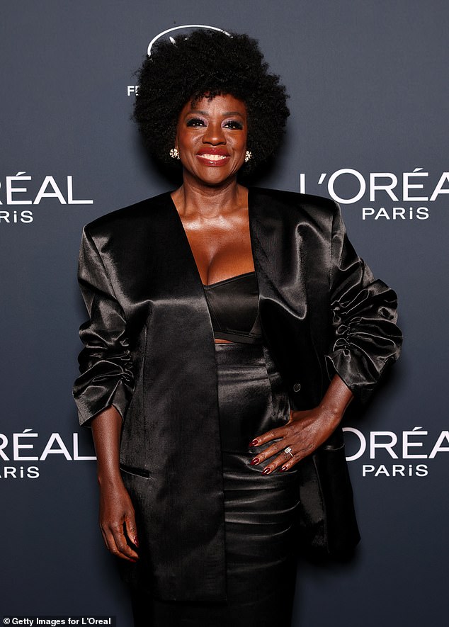 She paired the skirt with an oversized satin blazer and a triangle bra, as her skirt featured a long train