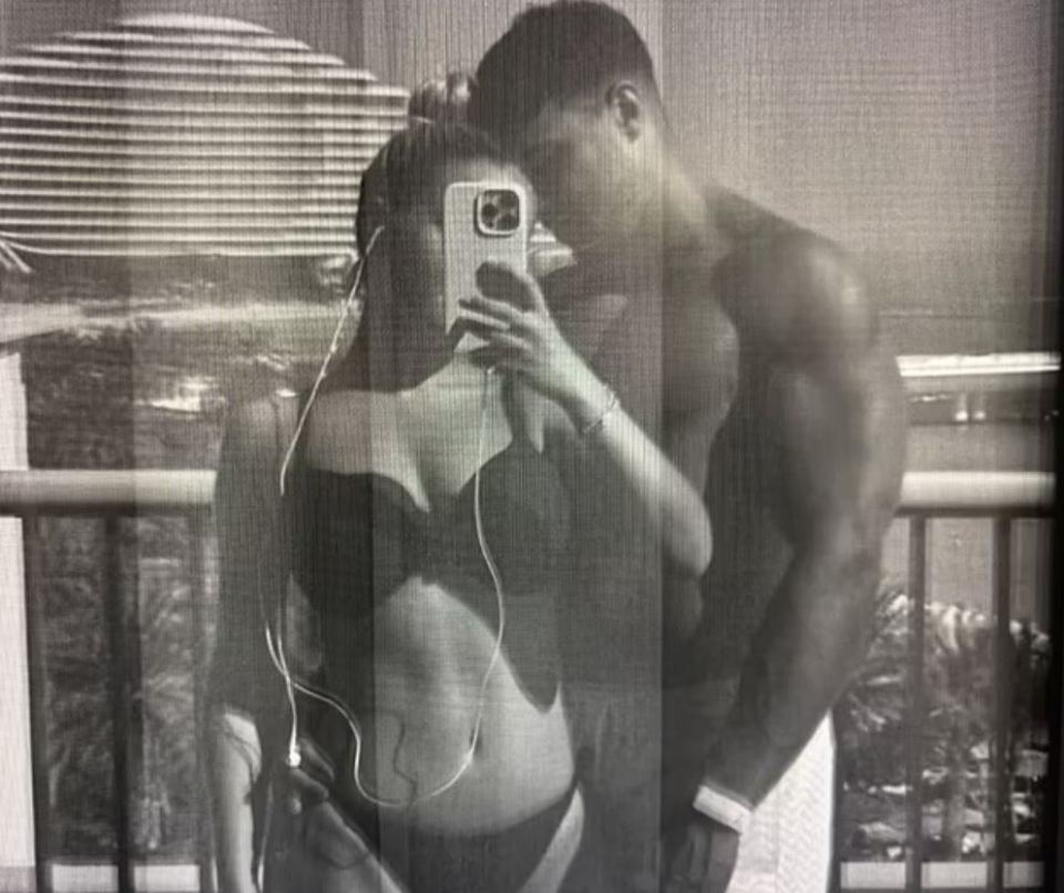 Black and white photo of Molly Mae Hague and Tommy Fury taking a selfie.