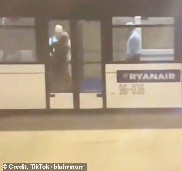 Police were seen bringing the woman to the ground