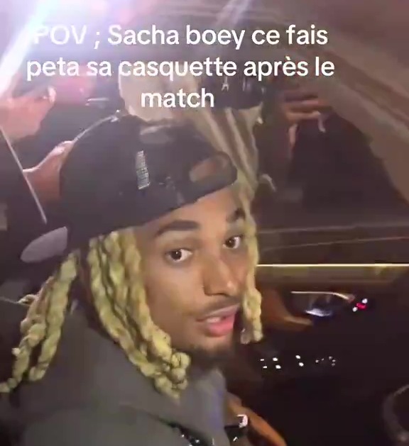 Man in car after a match.