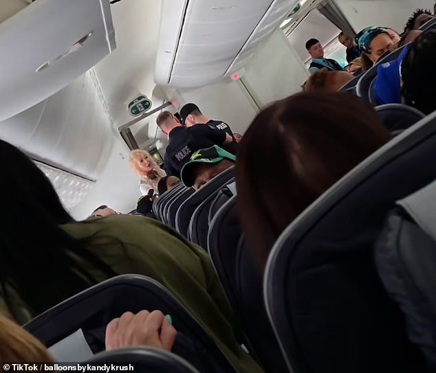In a chaotic clip posted to TikTok , the duo of blonde women were filmed causing a scene while being led off a flight from Manchester to the Caribbean island on May 28