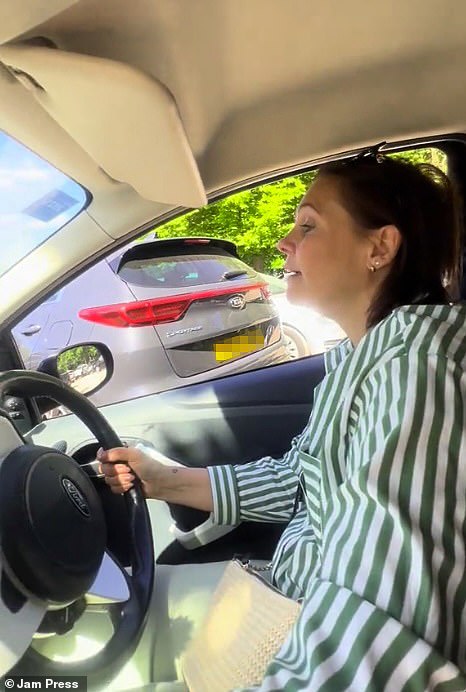 Jennifer Plumbley, 48, had been queuing with her friend Helen (pictured) for 45 minutes to get into the busy Richmond Park car park in south London