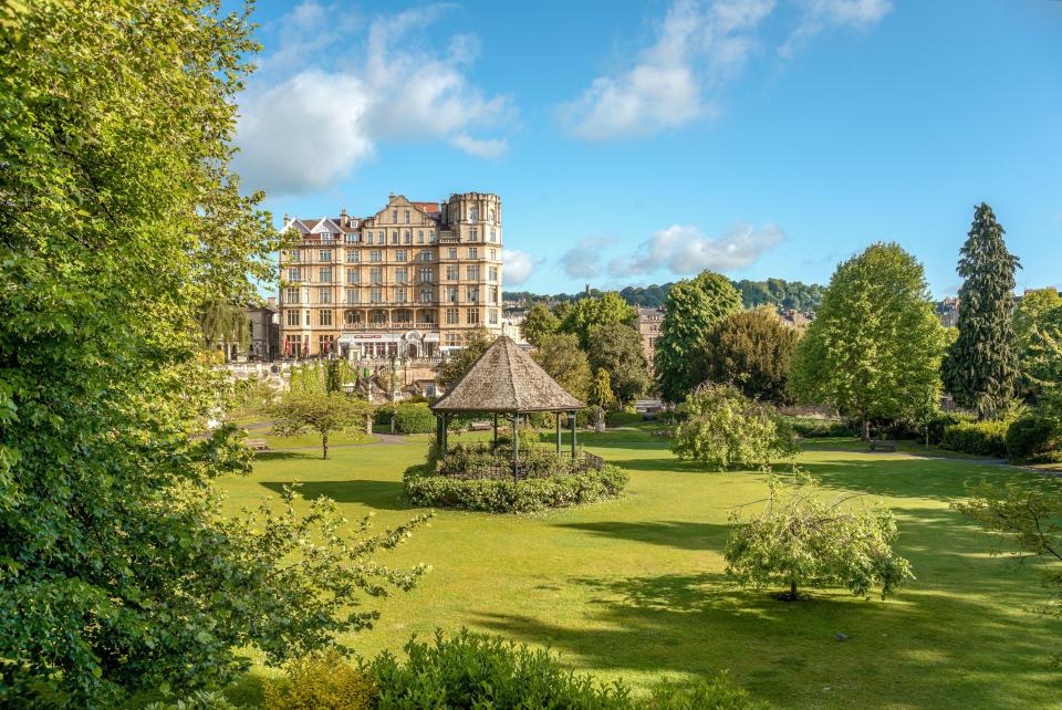 Parade Gardens in Bath, England, with a gazebo and a large building in the background.