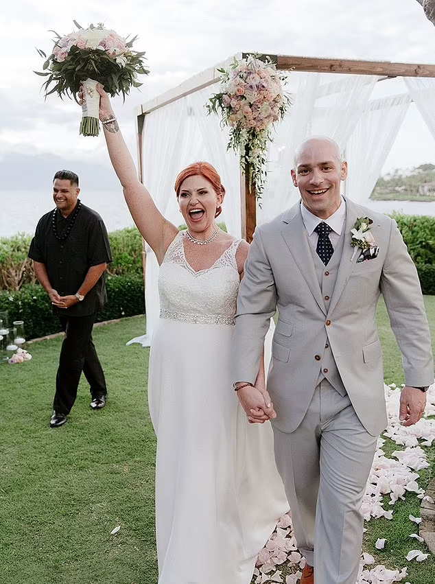 Newlyweds walking down the aisle after their Maui wedding ceremony.
