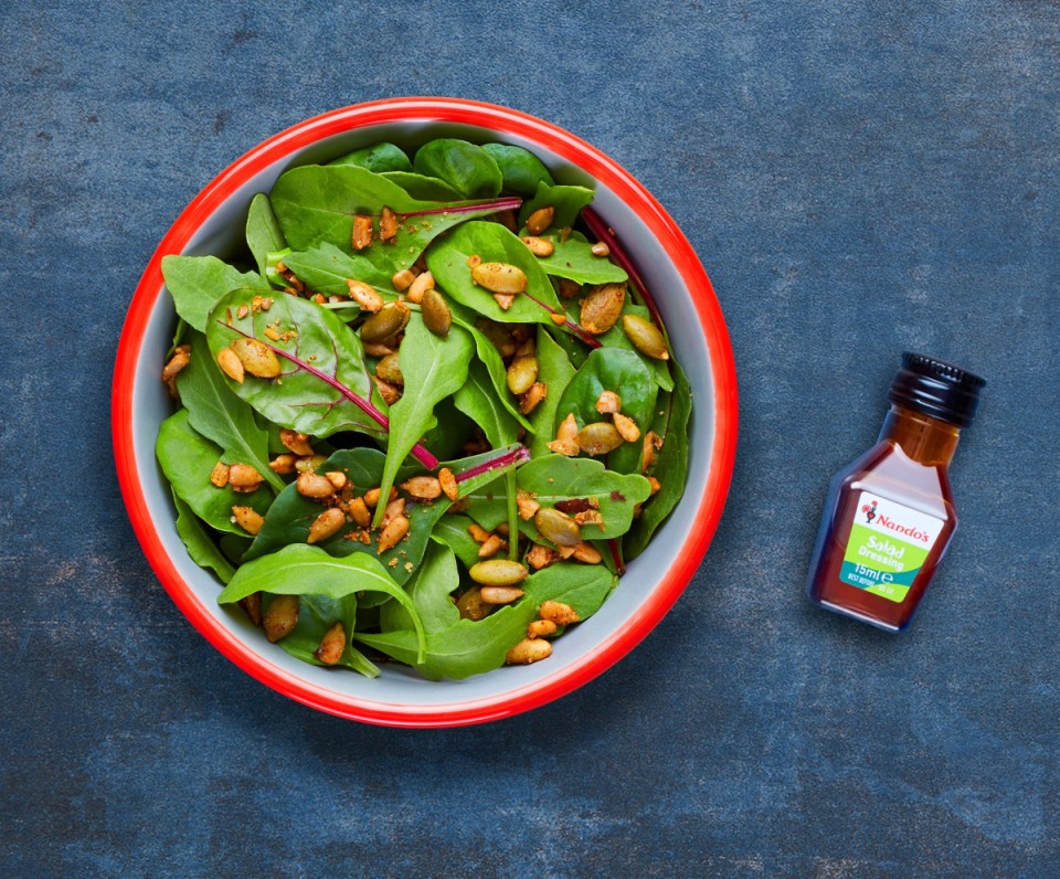 Leafy salad with seeds and Nando's salad dressing.