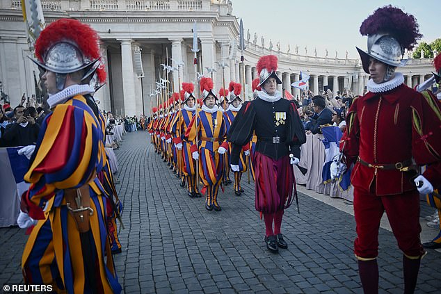 Swiss guards gather after white smoke rose from the chimney on the Sistine Chapel