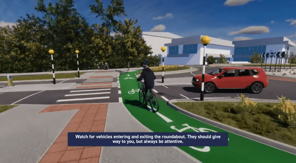 Screenshot of a cyclist approaching a roundabout.