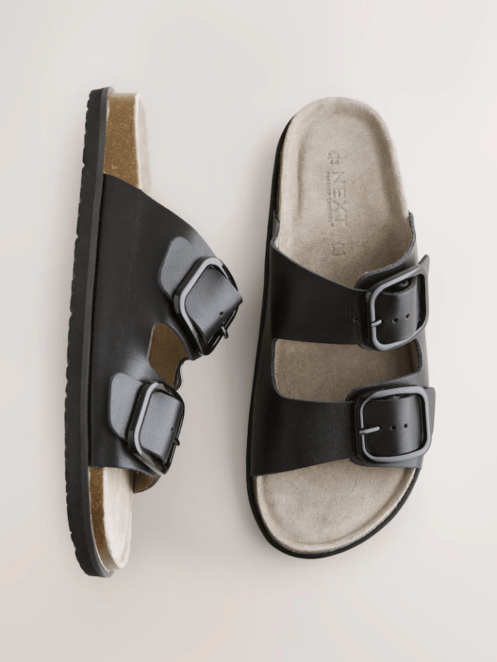 Pair of black double buckle sandals.
