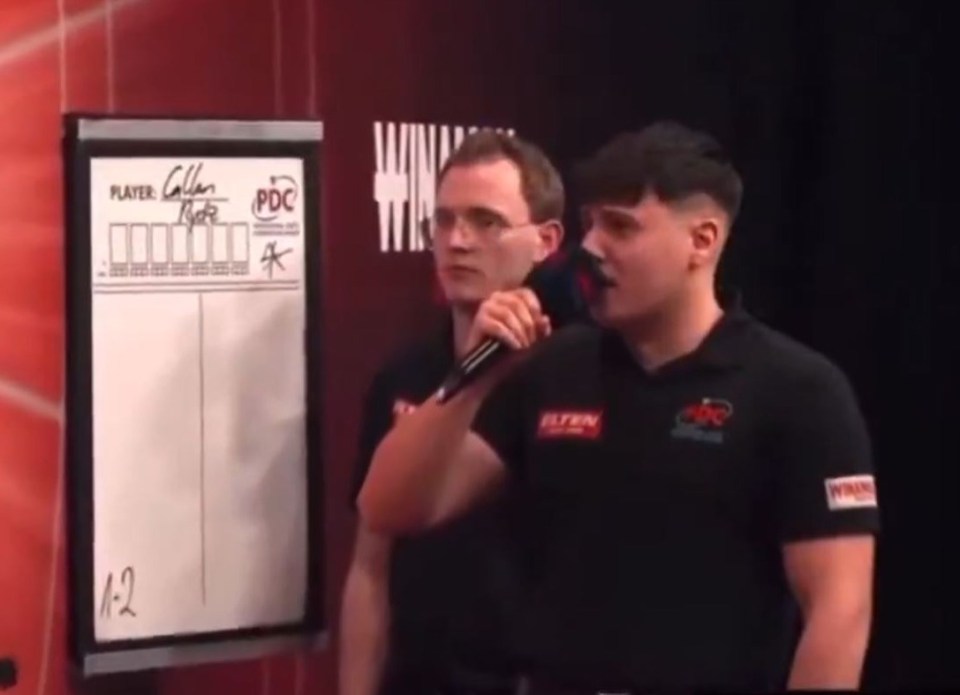 Darts players Andrew Gilding and Callan Rydz during a match.
