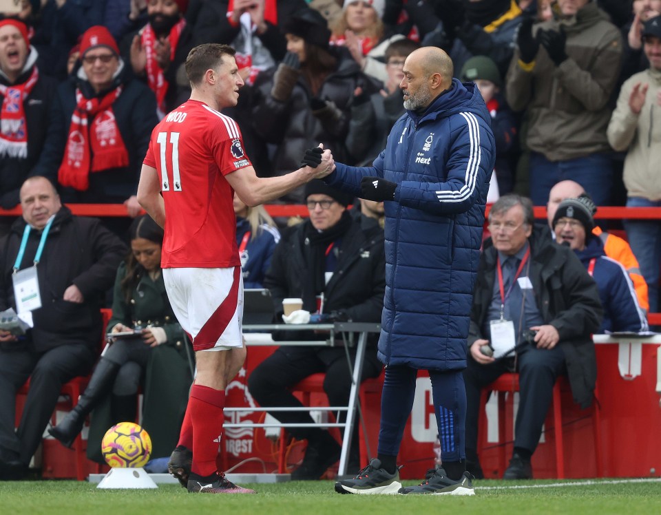 Nottingham Forest manager Nuno Espirito Santo congratulates Chris Wood after a Premier League match.