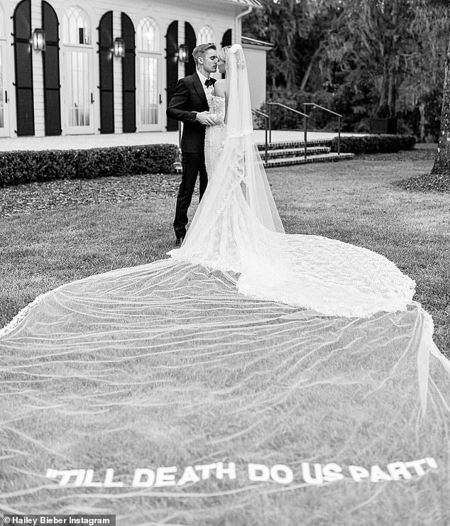 When Hailey Bieber said 'I do' to Justin Bieber in 2019, she did so in a custom gown and veil designed by the late Virgil Abloh, with the words 'Till Death Do Us Part' embroidered on the 75-ft-long tulle