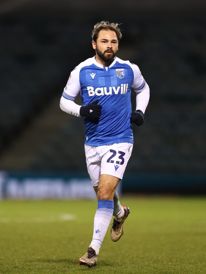 Bradley Dack of Gillingham F.C. running on the soccer field.