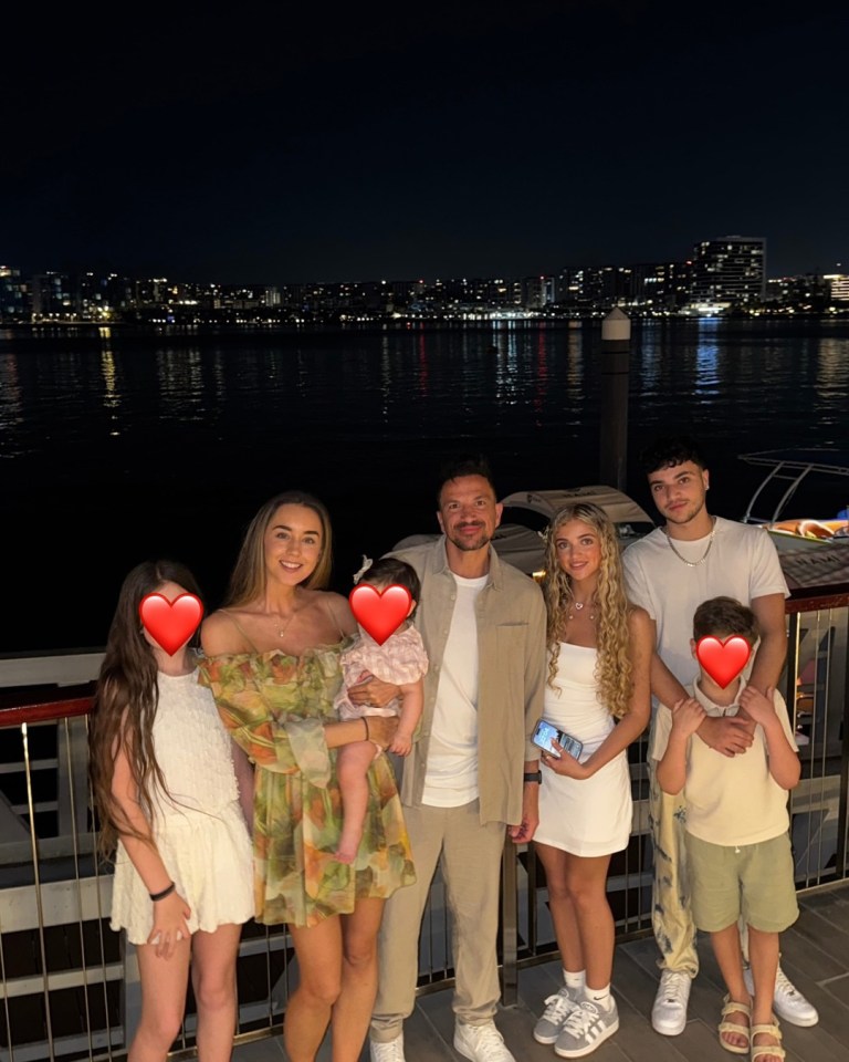 Family photo at night by the water.