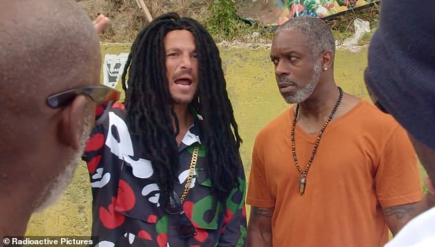 The singer has been accused of 'posing in modern blackface,' after wearing dreadlocks and adopting Jamaican accent for his role as con artist Gary Buckle