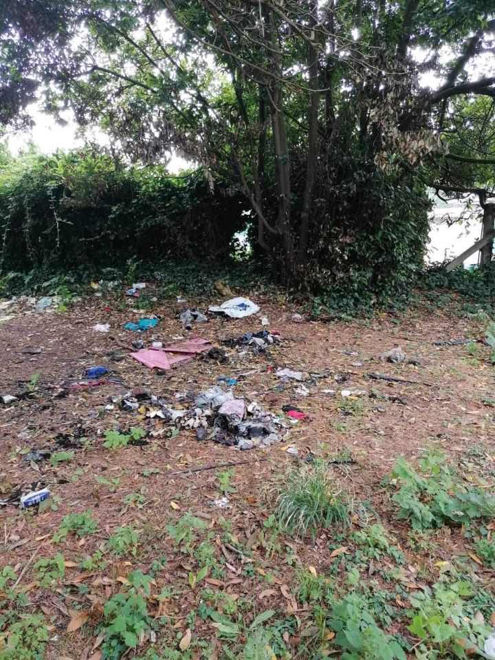 Fly-tipped rubbish and drug paraphernalia near tennis courts.