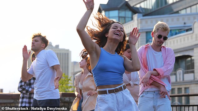 Drinking and smoking is a classic party combo, but the latest research shows both may raise the risk of colon cancer in young people (stock image)