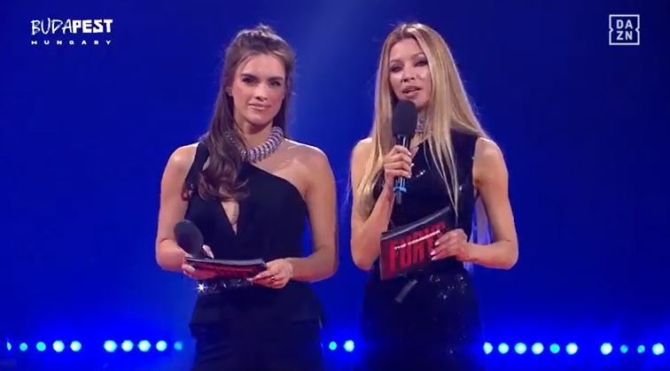 Two women presenters at a boxing event.