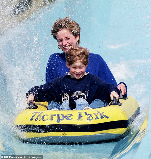 Princess Diana enjoys a ride with her youngest son Harry at Thorpe Park in 1992